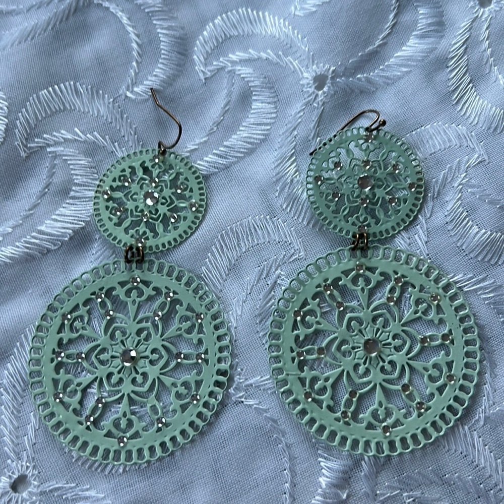 Mint green dangling earrings with clear studs.  Material is aluminum-like/hard.